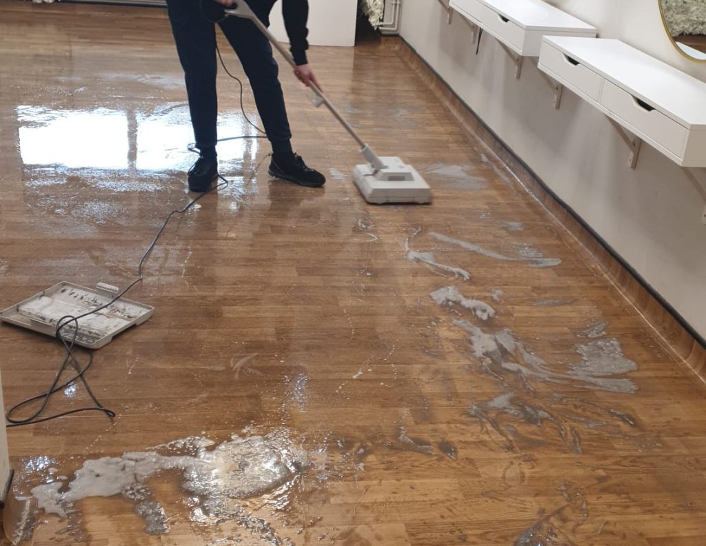 Professional Hard floor cleaning service restoring a hard floor to like-new condition