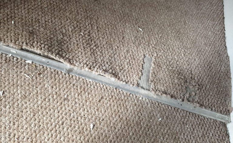 Carpet repair Walsall door threshold showing damage and fixed join
